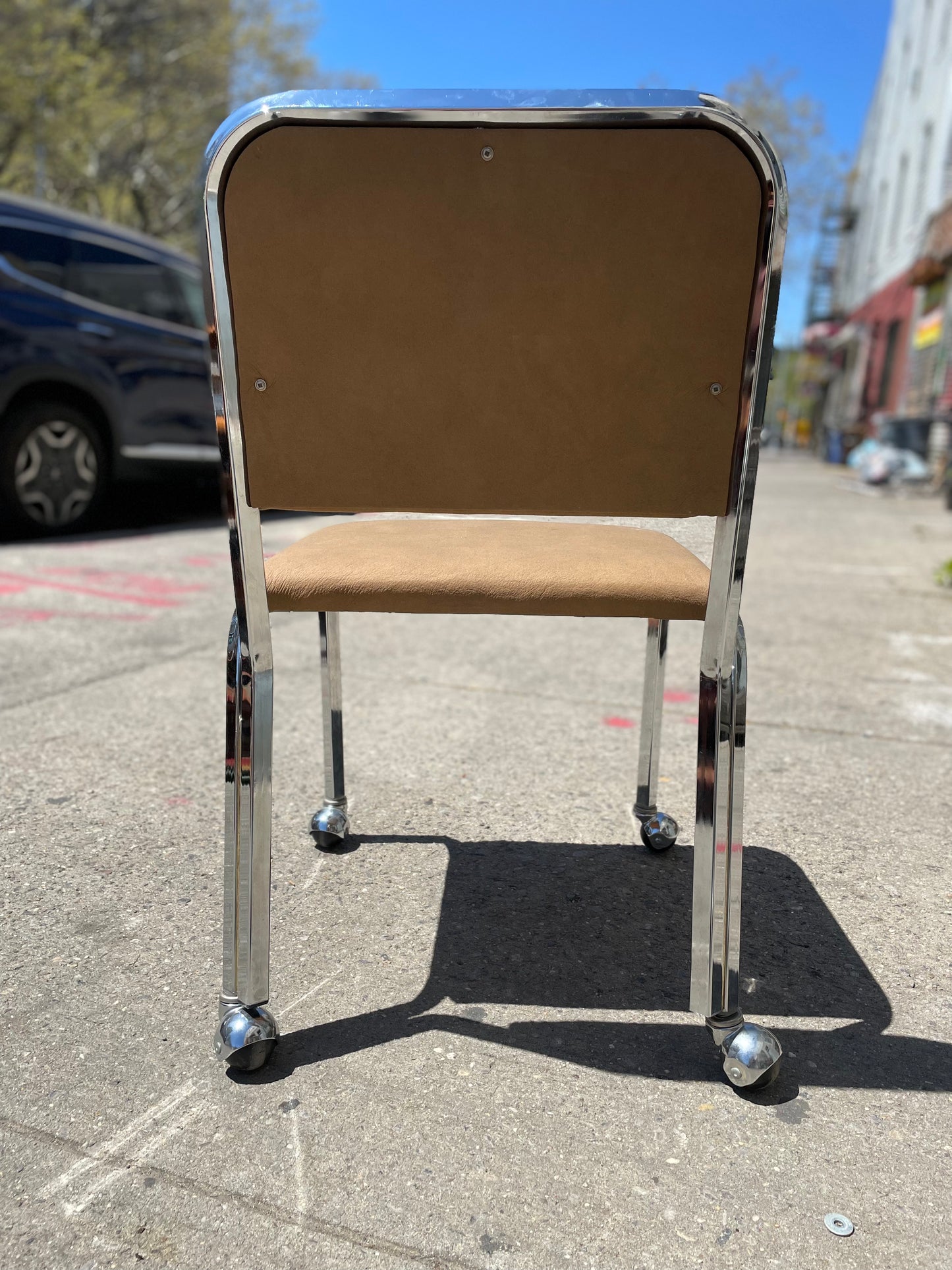 Pair of Tan Naugahyde and Chrome Dining Chairs on Wheels