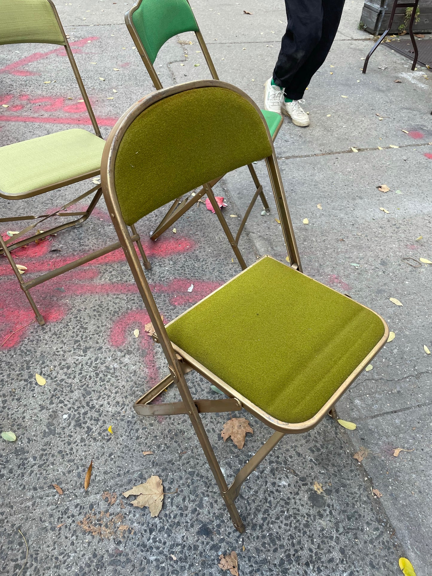 Pairs of Colorful Brass Folding Chairs