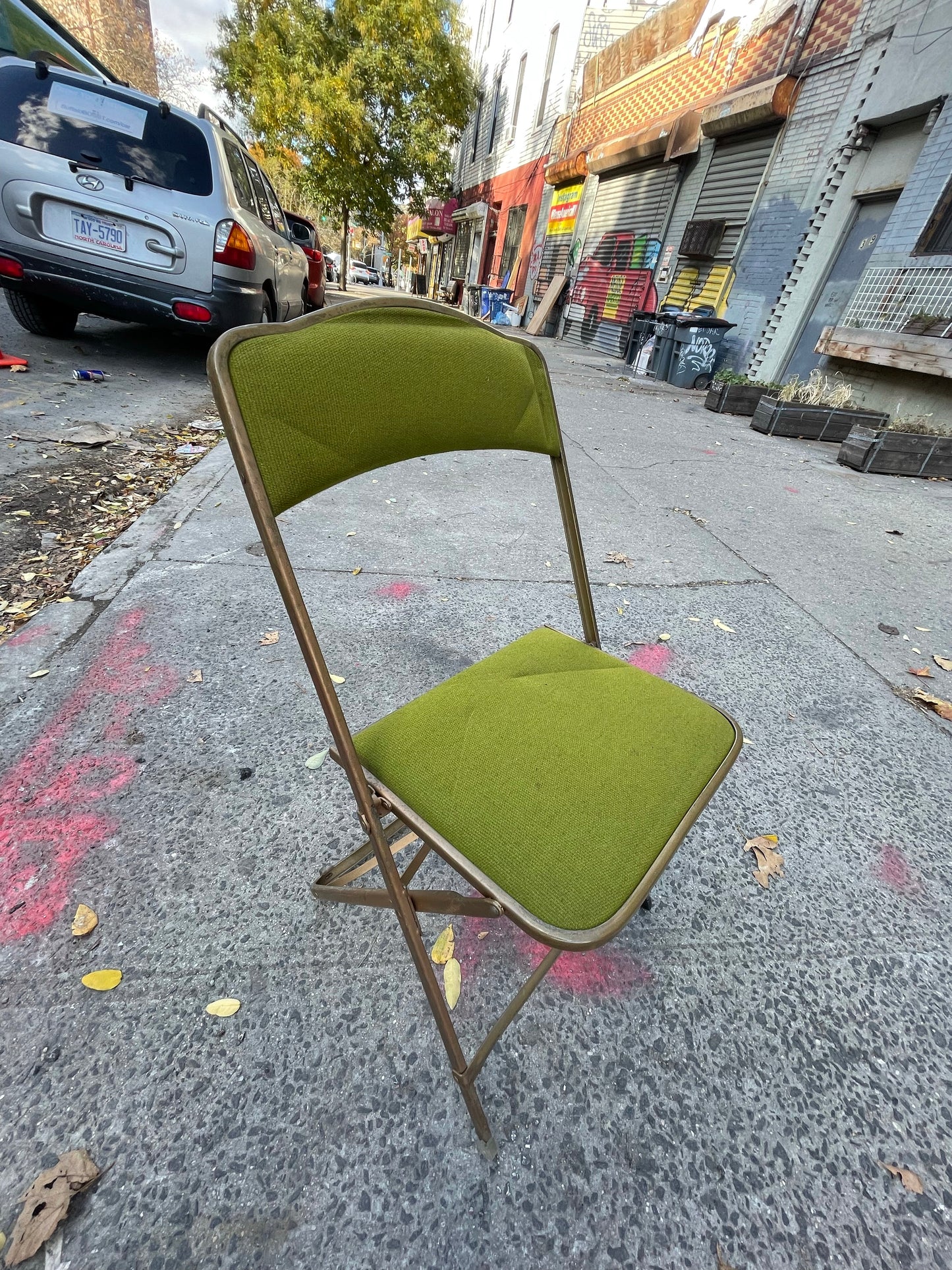 Pairs of Colorful Brass Folding Chairs