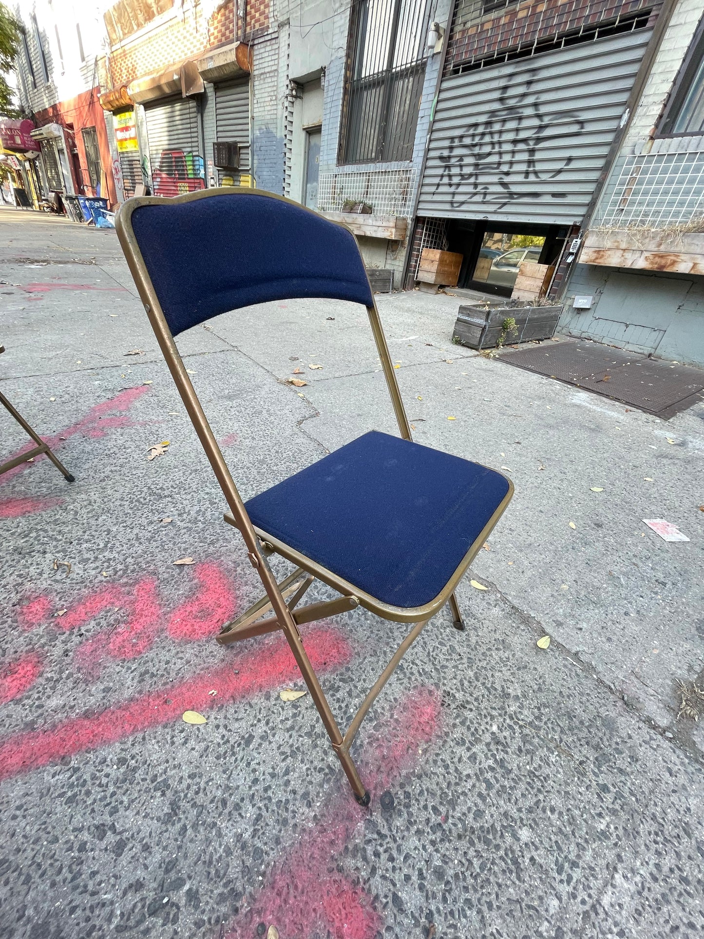 Pairs of Colorful Brass Folding Chairs