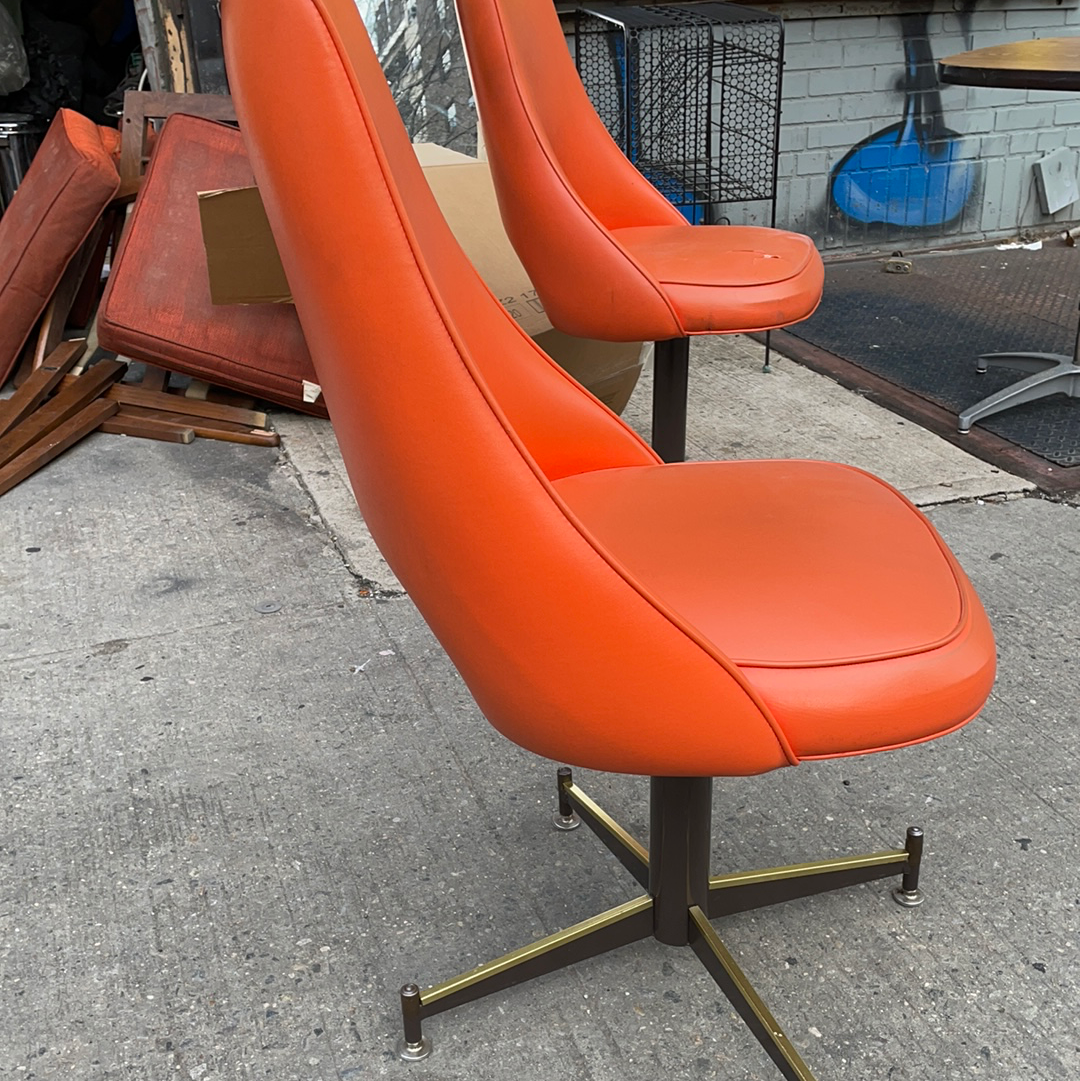 Pair of Orange Mid Century Swivel Chairs