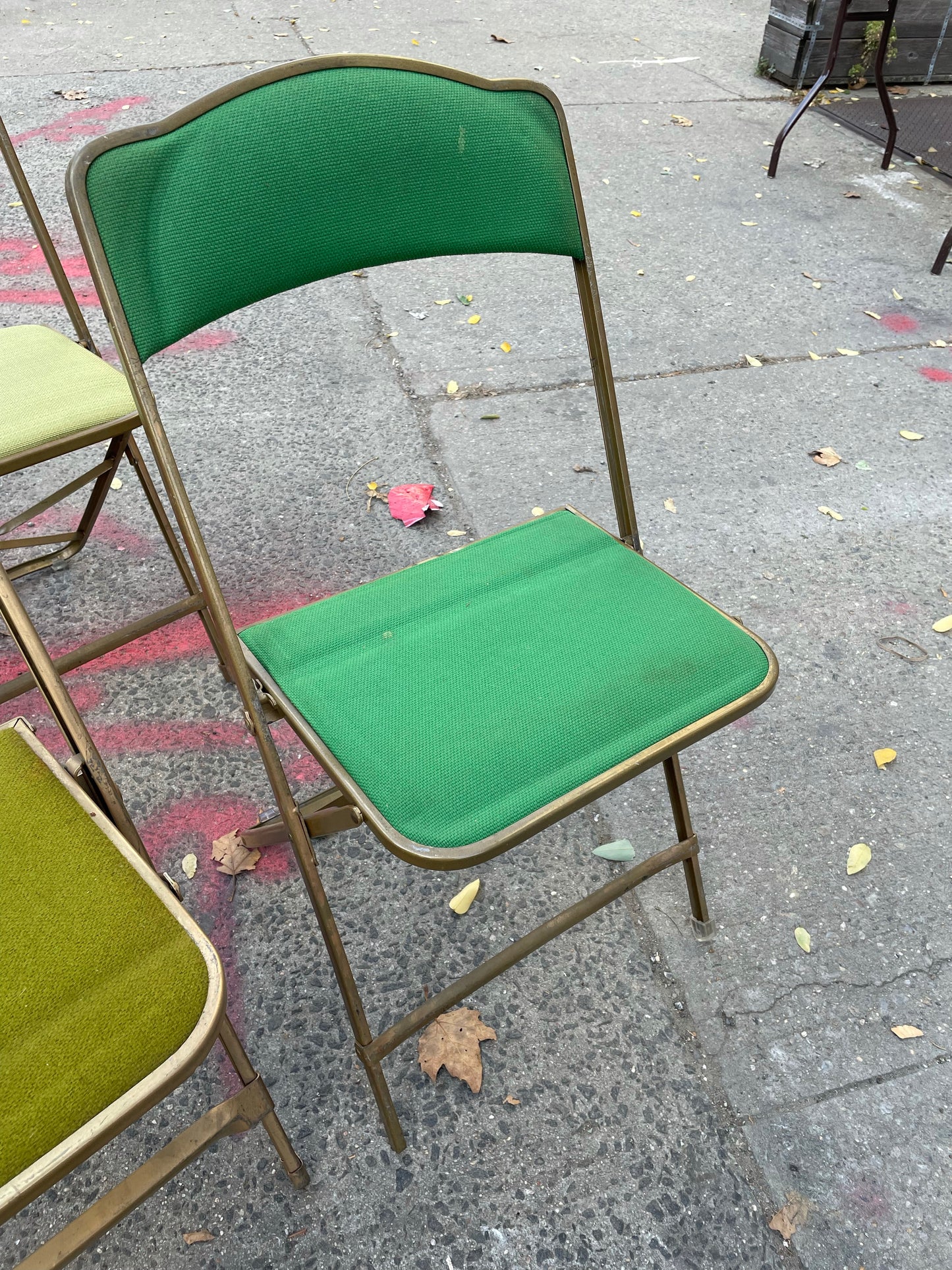 Pairs of Colorful Brass Folding Chairs