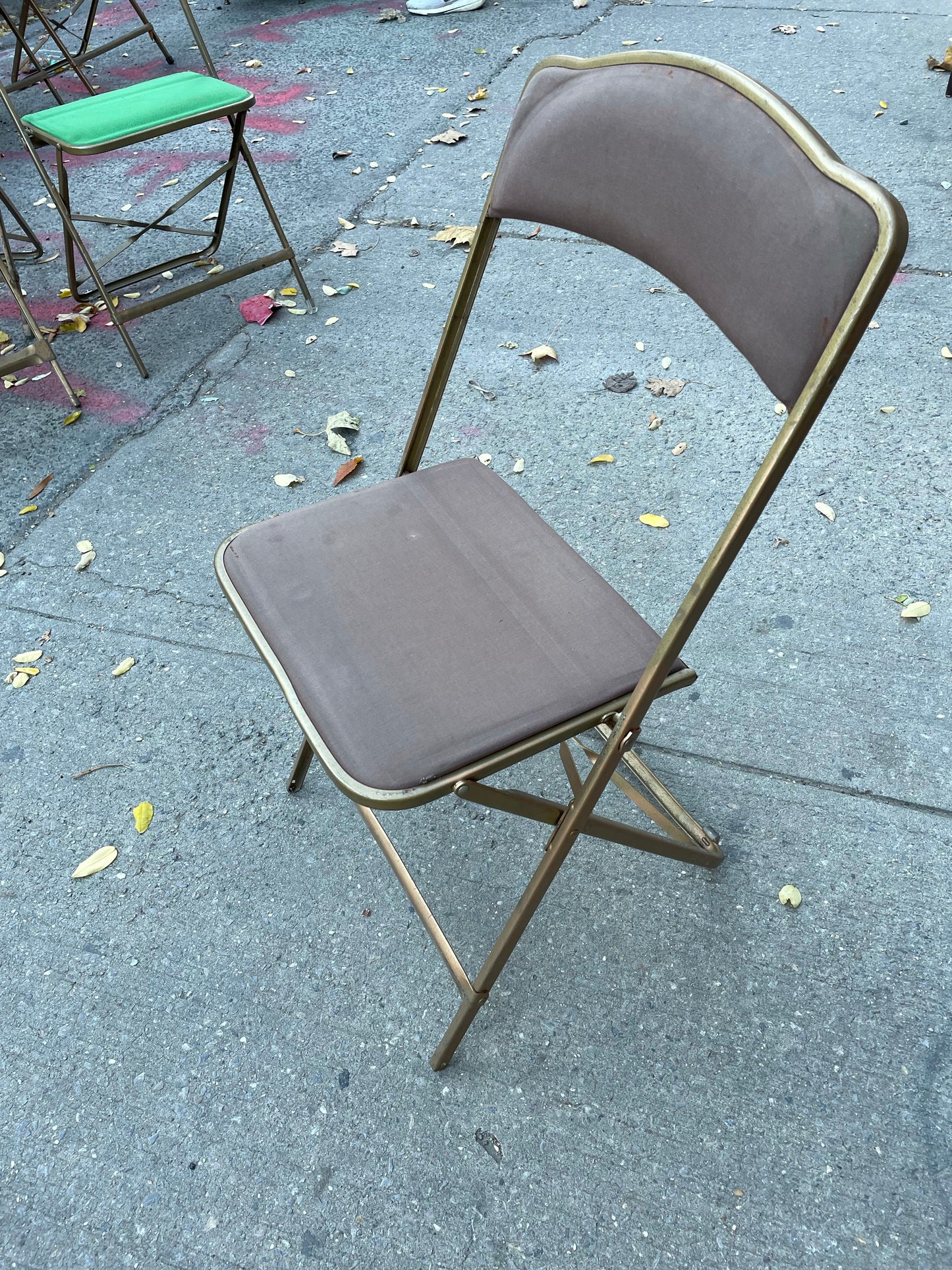 Pairs of Colorful Brass Folding Chairs