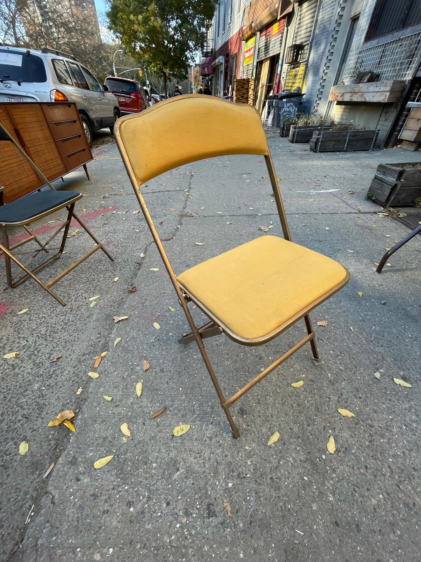 Pairs of Colorful Brass Folding Chairs