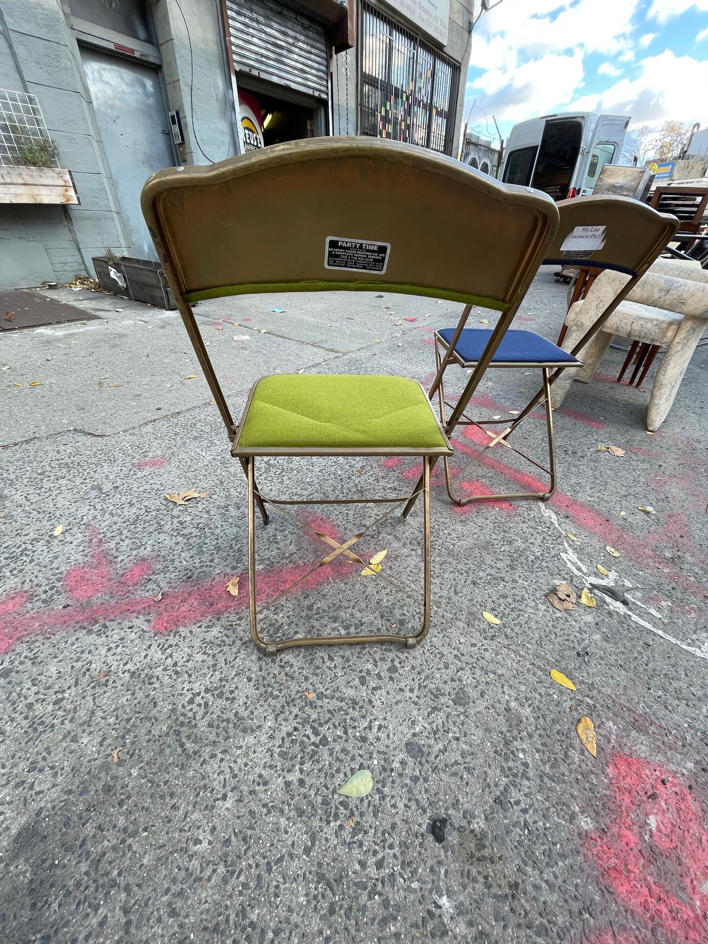 Pairs of Colorful Brass Folding Chairs