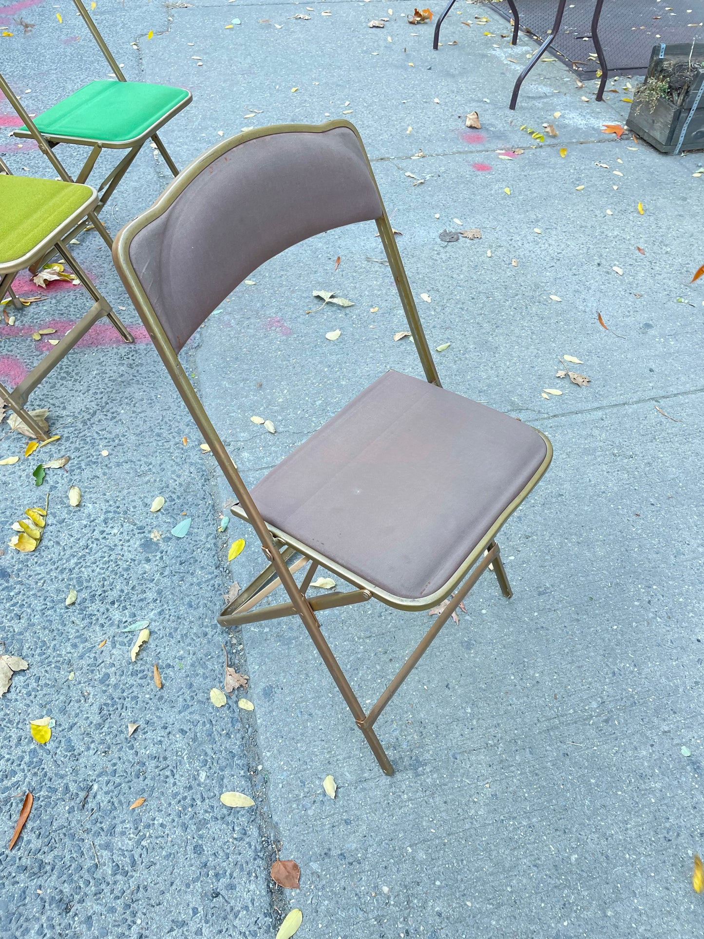 Pairs of Colorful Brass Folding Chairs